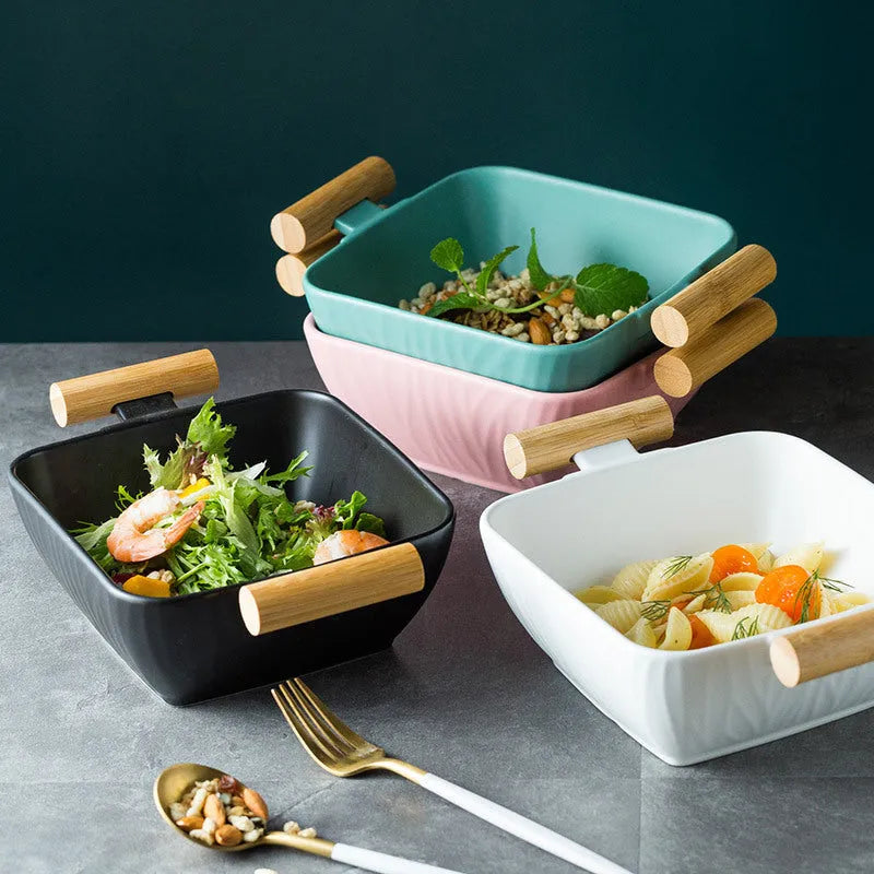 Porcelain ceramic bowl with irregular shape and matching lid in modern simple design