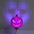 Plastic pumpkin lamp with USB cable, showing yellow and purple light options, scale shown against 8.3x22cm dimensions