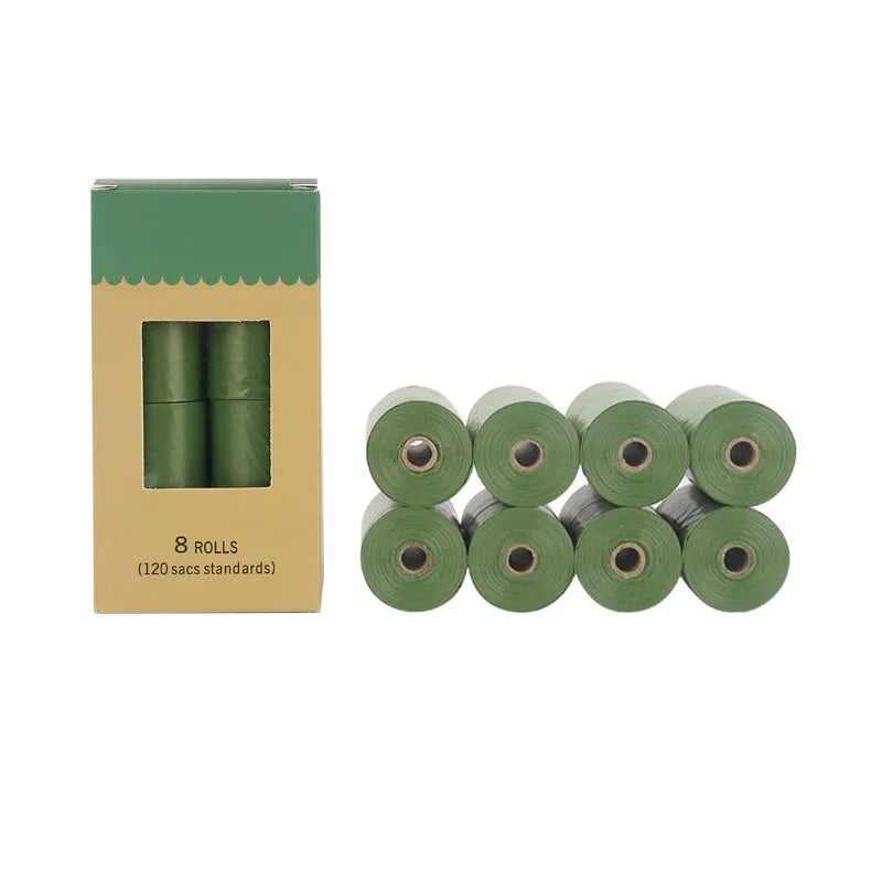 Green EPI degradable pet waste bags on a roll next to a white dispenser.