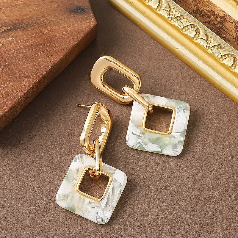 Copper geometric square earrings with hollow construction and chamfered pattern