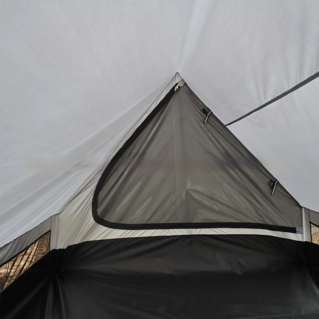 Brown A-line tent pitched with hiking poles, showing guy lines and aluminium ground nails.