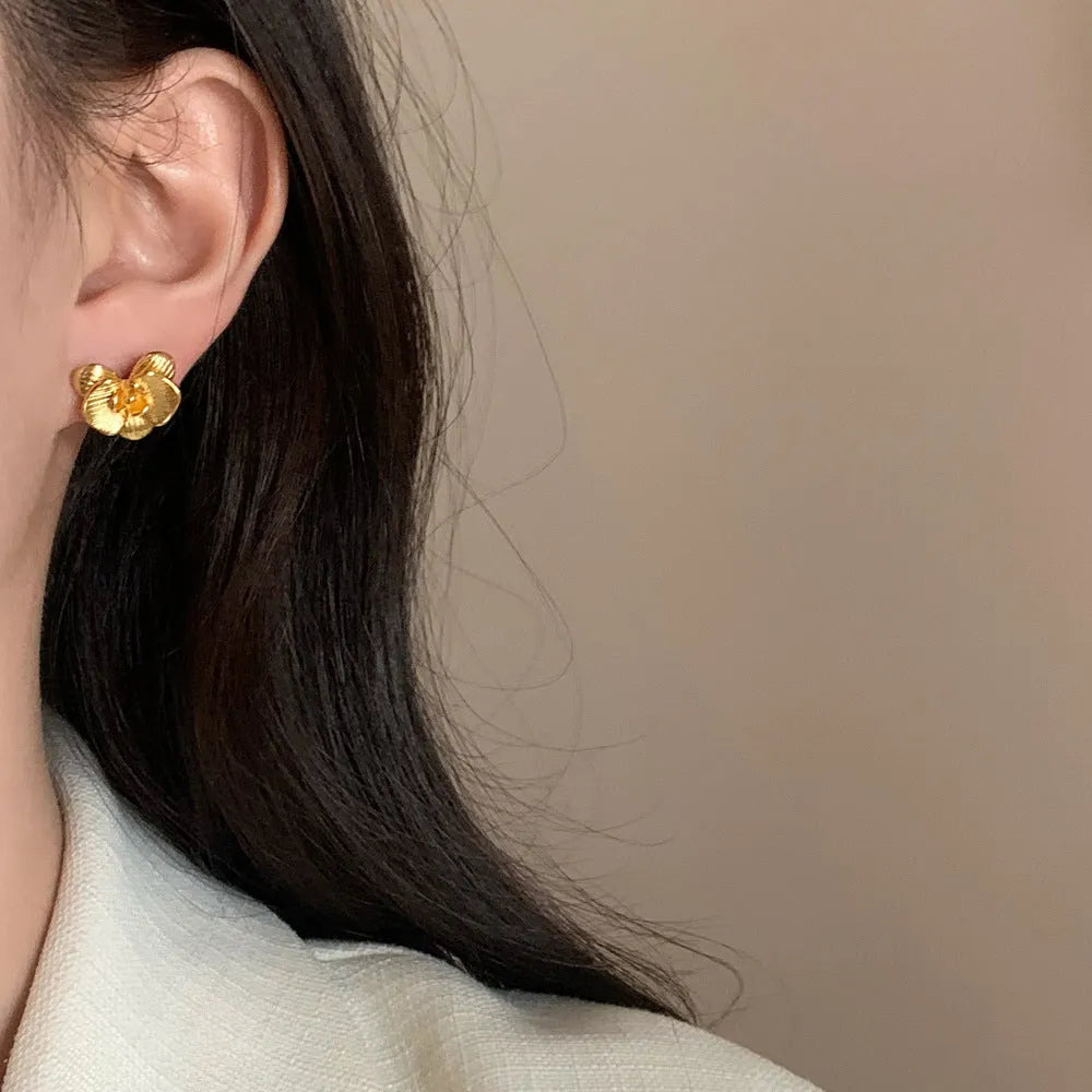 Retro style flower earrings with petal detailing in gold or silver electroplated finish on copper