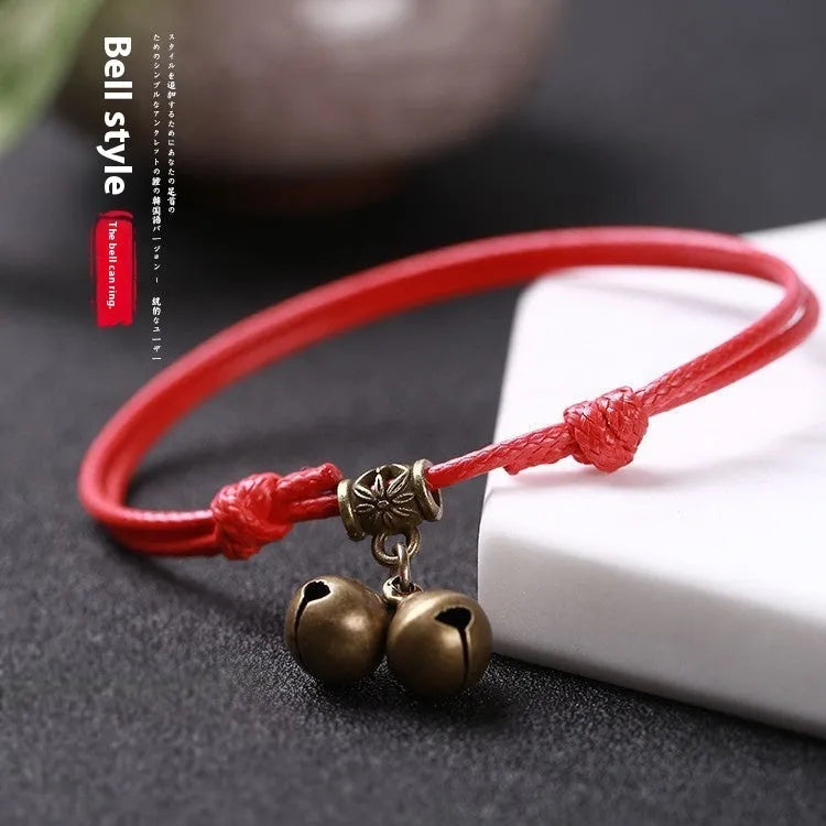 Nylon rope dog collar with a brass bell, shown in black, red, and coffee colour options.