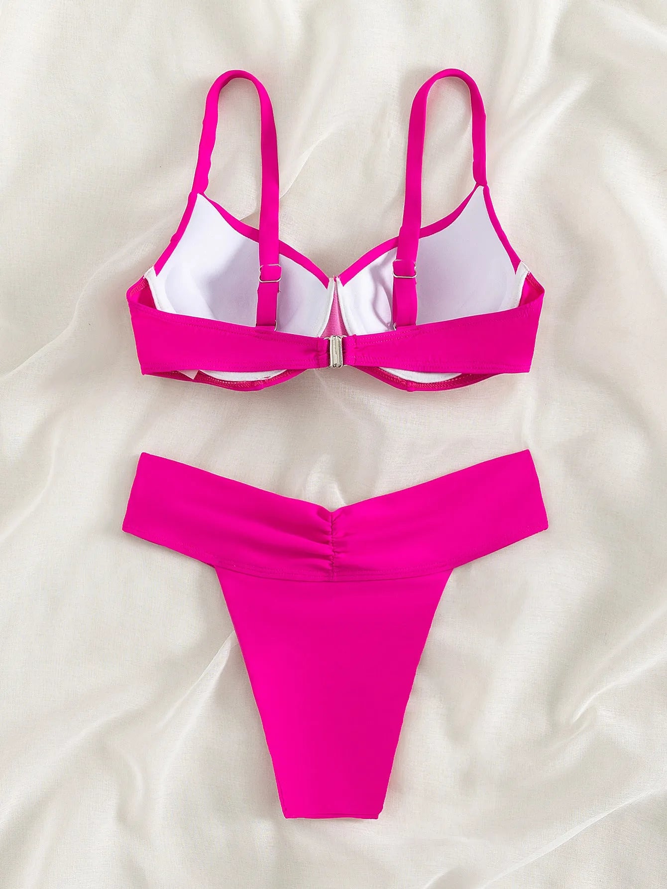 Solid colour nylon split bikini swimsuit in fluorescent green, shown as a bra and panties set.