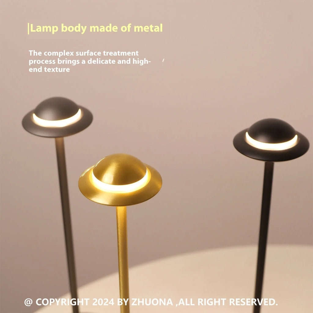 Black UFO-shaped metal desk lamp with touch dimming and three colour light modes