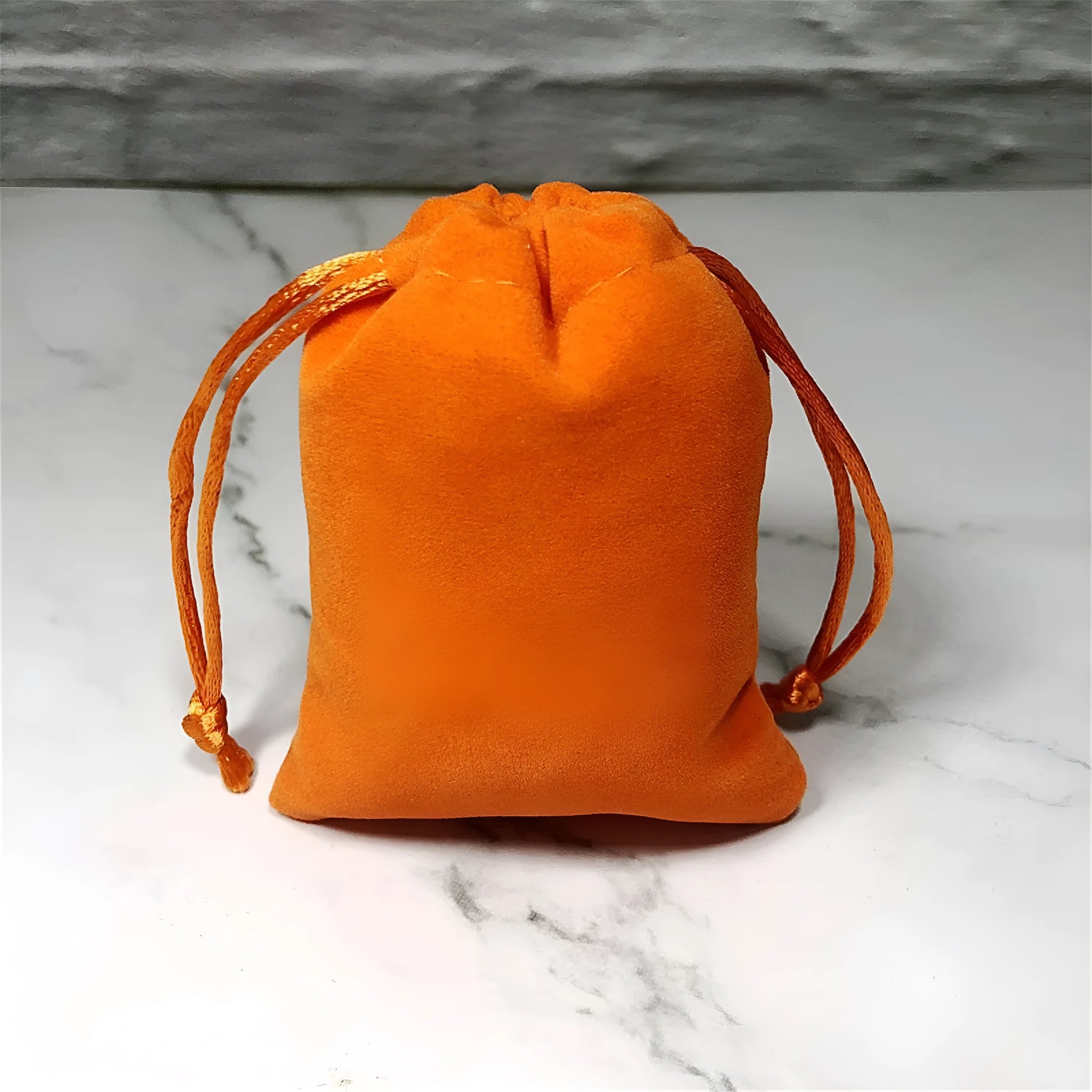 Flannel drawstring bag with beam opening, available in multiple colours and sizes for storage or gifting