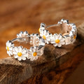 White daisy flower ring earrings with platinum gemstone accents on copper base