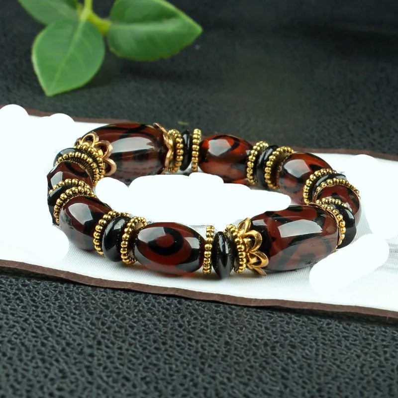 Distressed agate Tibet beads bracelet with three eye dzi design and polished stone beads