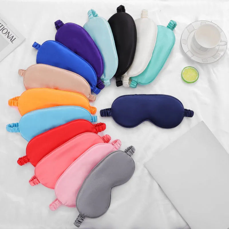 Double-sided rayon elastic satin sleep mask shown in multiple colour options including black, sky blue, and wine red.
