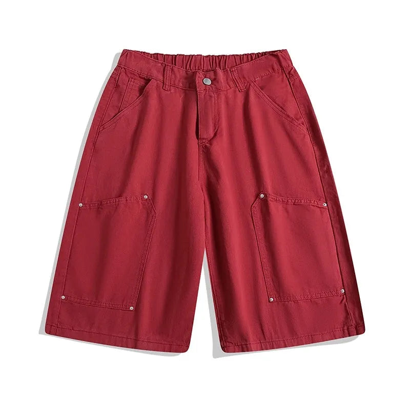 Women's apricot workwear-style cropped pants with wide legs and pocket rivets.