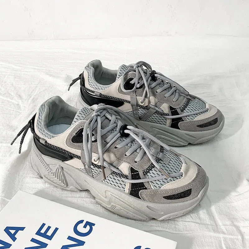 Men's white platform dad shoes in Korean style with front lace-up and mesh lining.