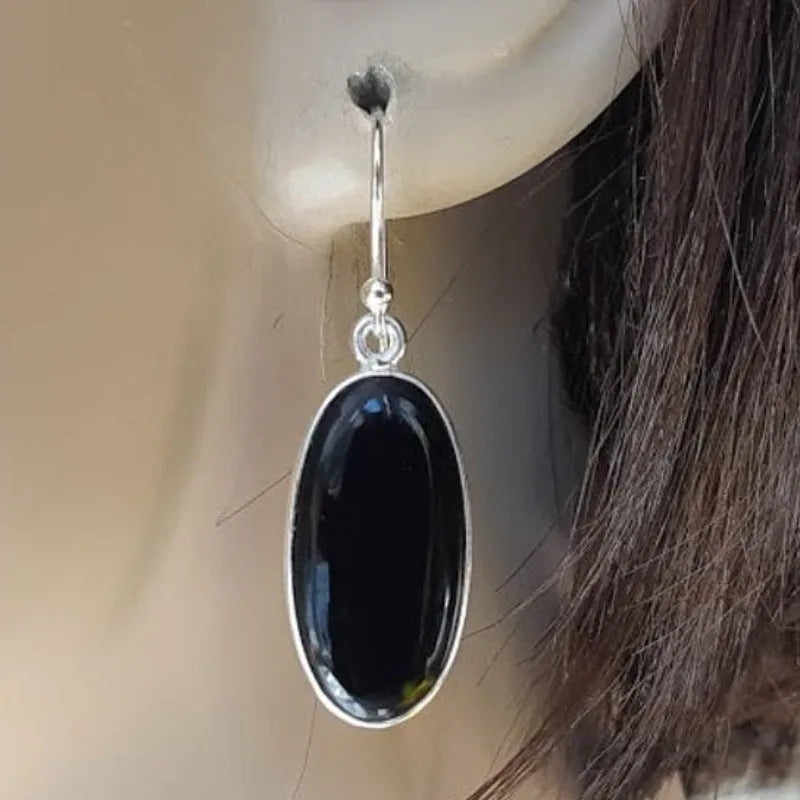 Women's geometric silver earrings with black agate oval pendants on silver chain