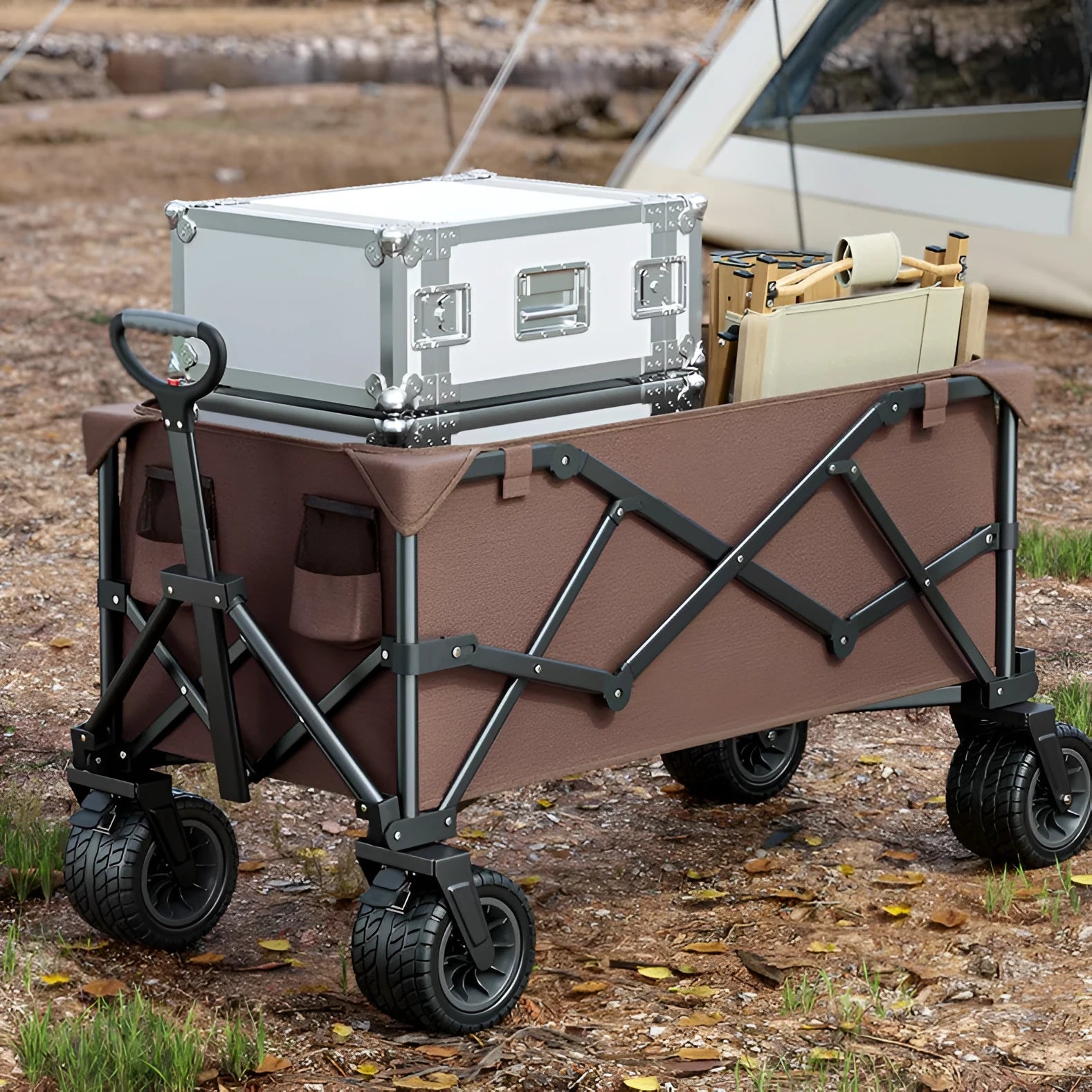 Foldable camping cart in black with 600kg capacity and push-pull handle on grass