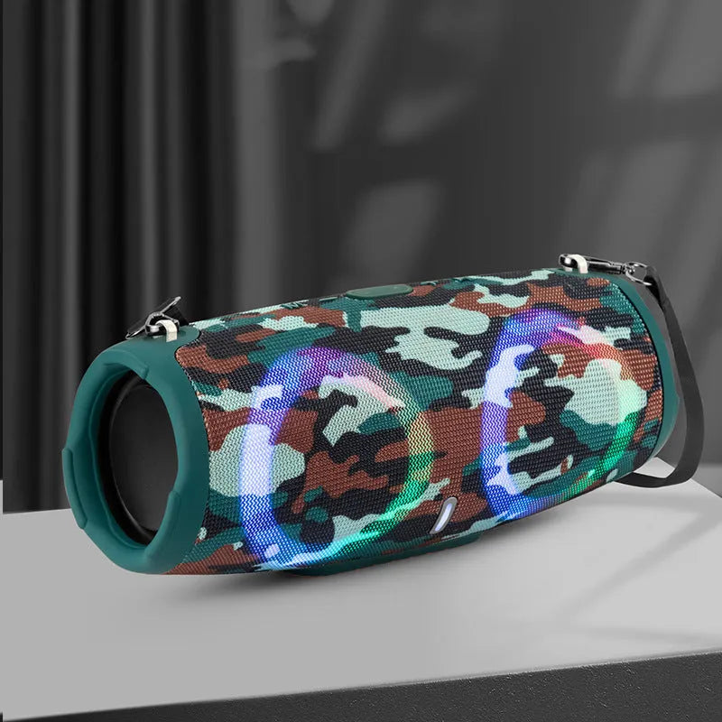 War Drum portable Bluetooth speaker with RGB coloured lights in black, showing built-in strap and control buttons.