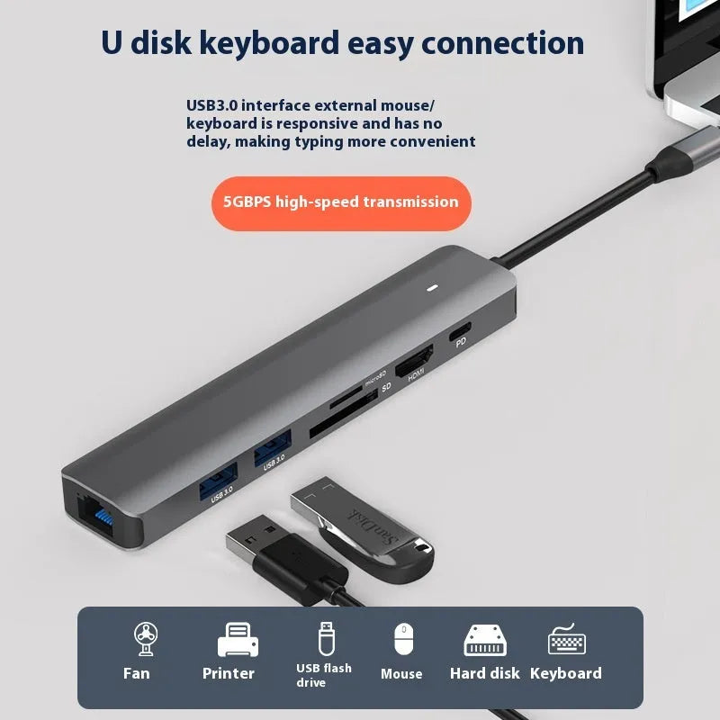 LQT-LH07 model 7-in-1 silver USB C hub showing USB-C plug, PD port, USB-A ports, and SD and microSD card slots.