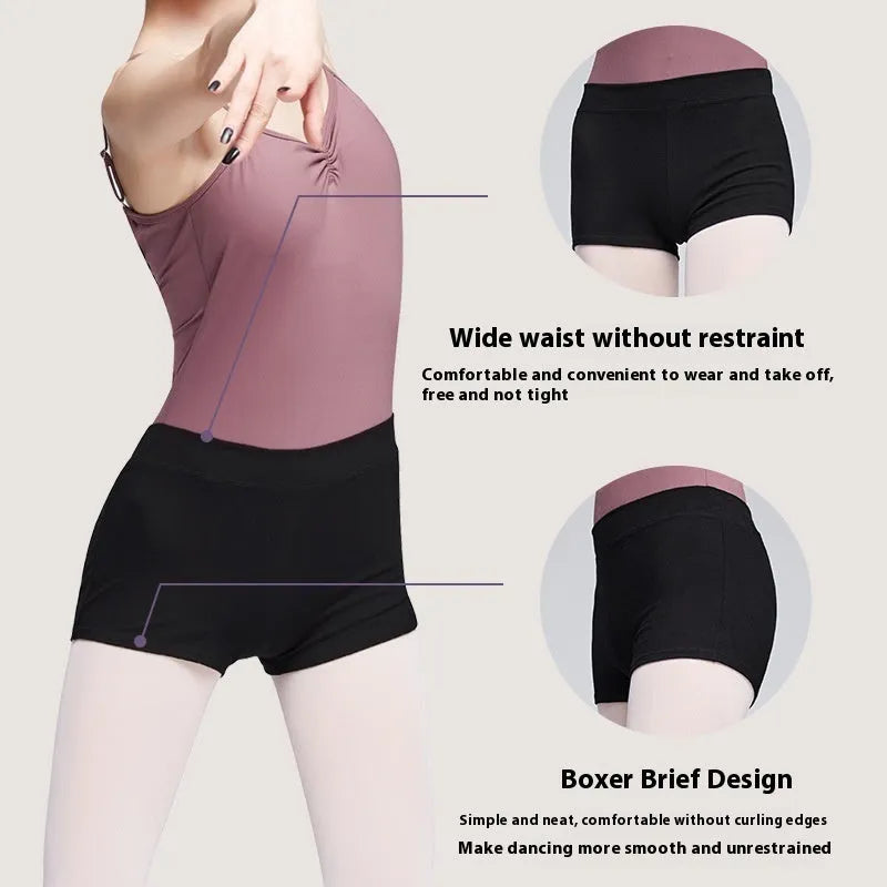 Black cotton women's ballet practice trousers laid flat, showing solid colour and fit for dance exercise.