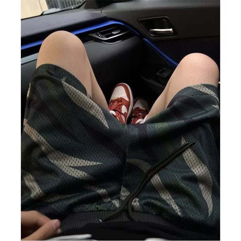 Men's camouflage pattern mesh shorts in cotton blend fabric with straight-leg cut
