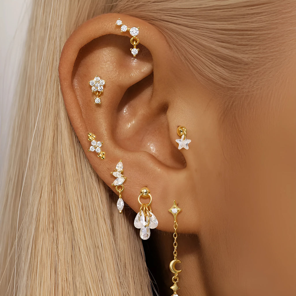 S925 sterling silver geometric moon and star drop earrings with diamond accents on a gold tone.
