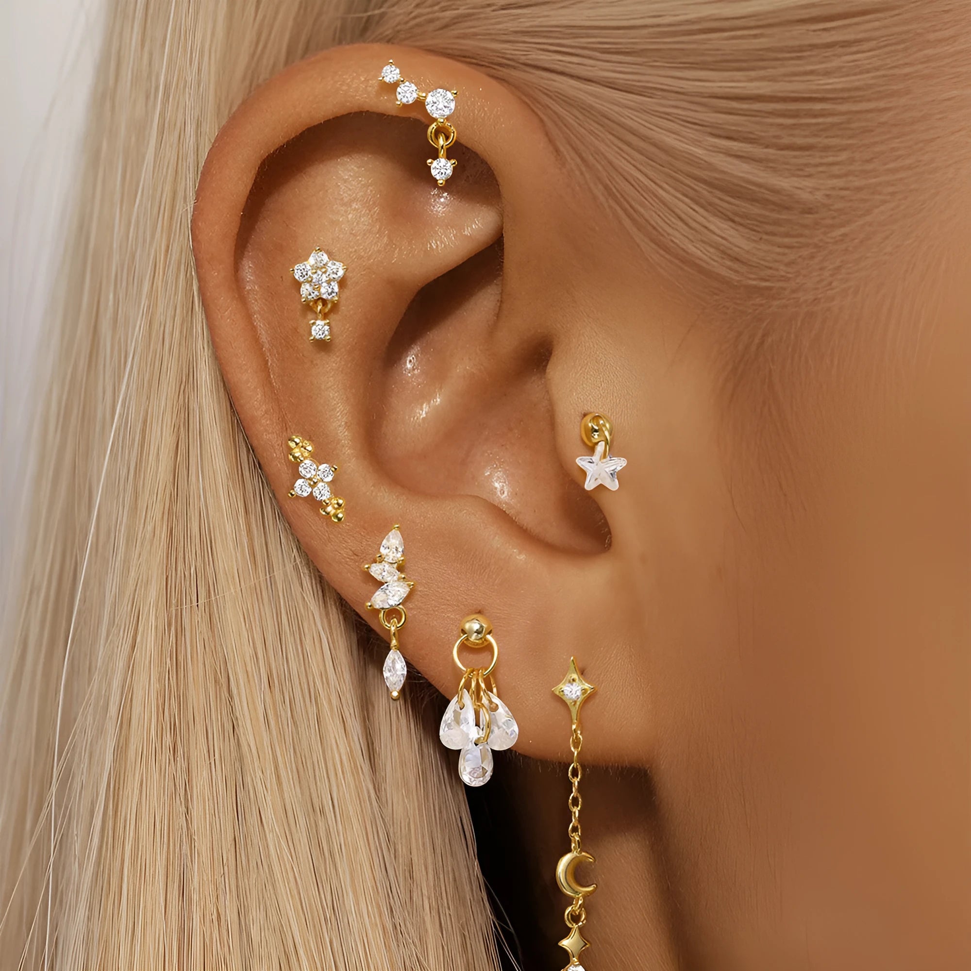 S925 sterling silver geometric moon and star drop earrings with diamond accents on a gold tone.