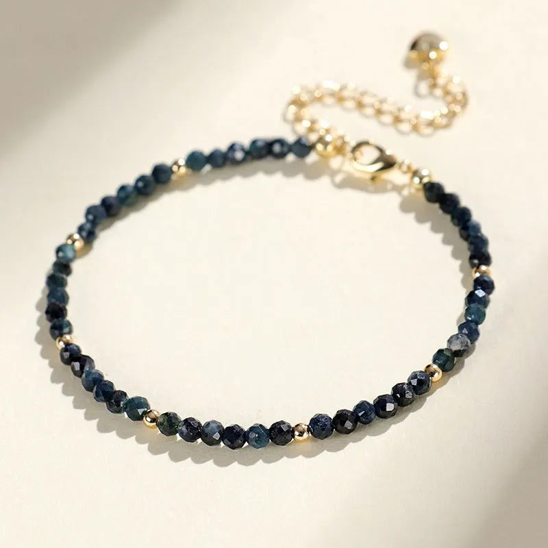 Blue tourmaline bracelet with 3mm cut beads and spacer bead design for women