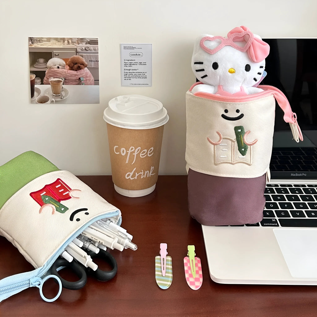 Brown Korean-style cartoon collapsible pencil case made from Oxford fabric, shown open and closed.