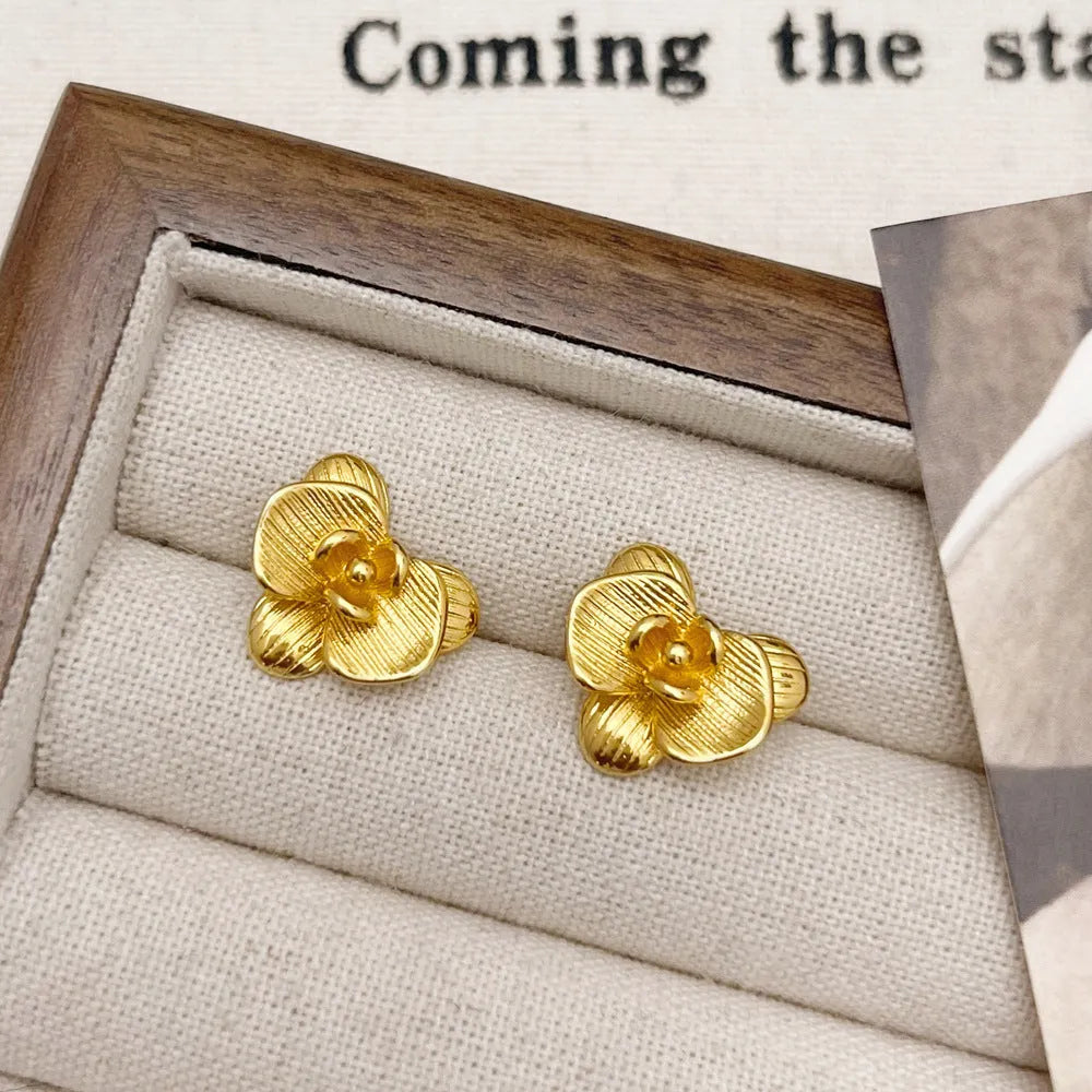 Retro style flower earrings with petal detailing in gold or silver electroplated finish on copper