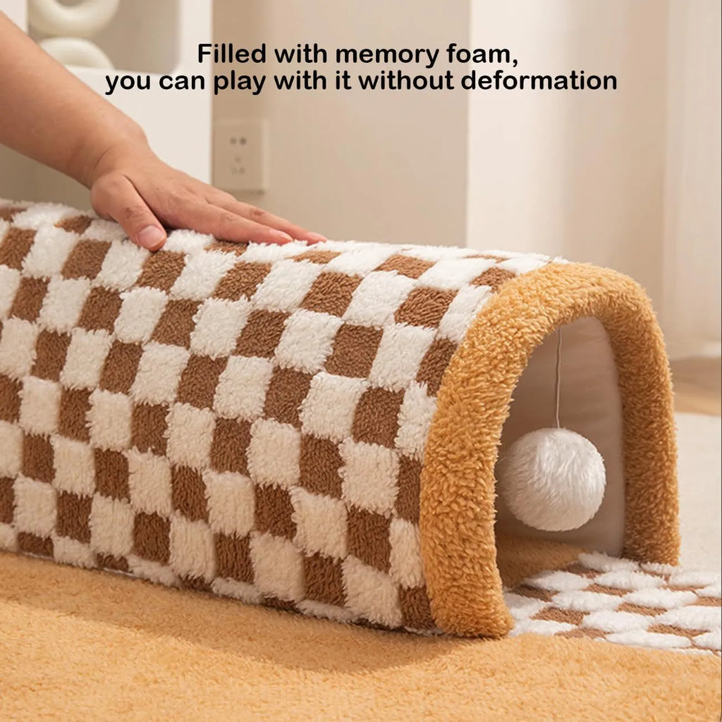 Coffee coloured plush fan-shaped pet bed with attached tunnel, showing anti-slip base.