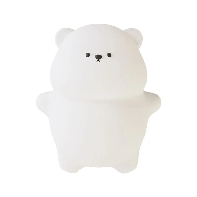 Lying flat bear silicone small night lamp with three-gear dimming and RGB colour switching on a bedside table