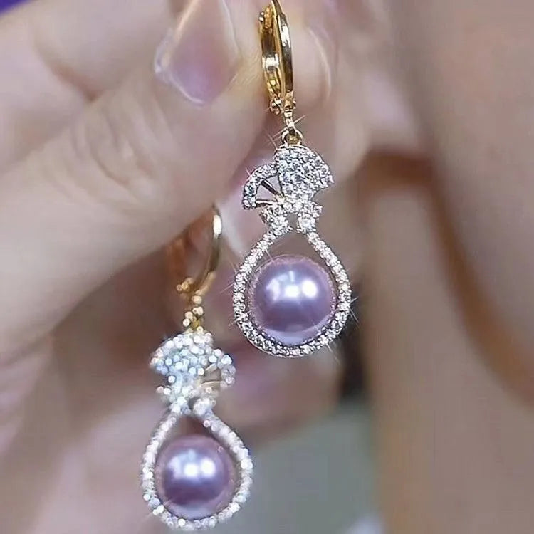 Purple alloy drop shape ear clip with crown design and electroplated finish for women