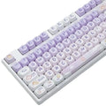Set of purple gradient key caps with a rabbit graphic, shown on a mechanical keyboard.