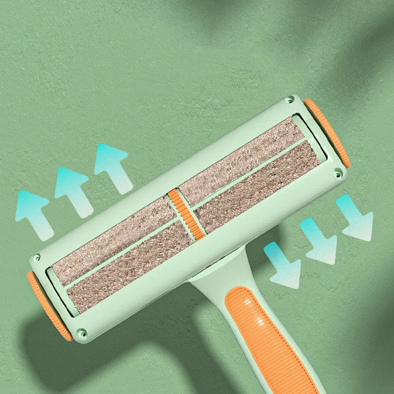 Two-way roller pet hair removal brush in green orange colour with ABS body and nylon fibre bristles on a beige sofa