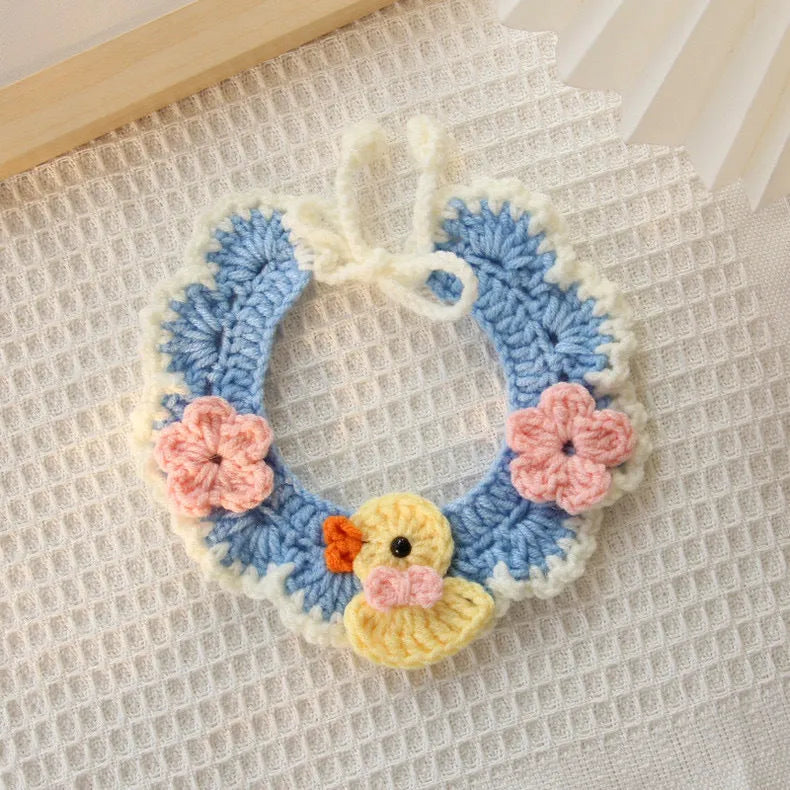 Hand-woven wool cat collar with cartoon Underwater World pattern in blue, size example on a light background