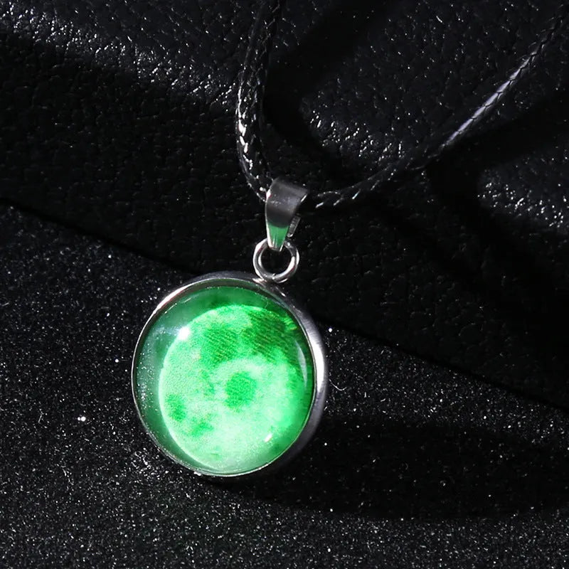Luminous alloy necklace with a glass pendant depicting a Christmas moon night sky, showing the extension chain.