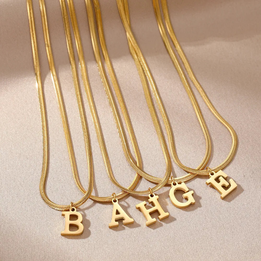A-Z letter pendant necklace in titanium steel with gold colour snake bones chain, unisex initial jewellery
