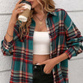 A woman wearing a loose-fit black and white plaid cotton shirt with long sleeves.