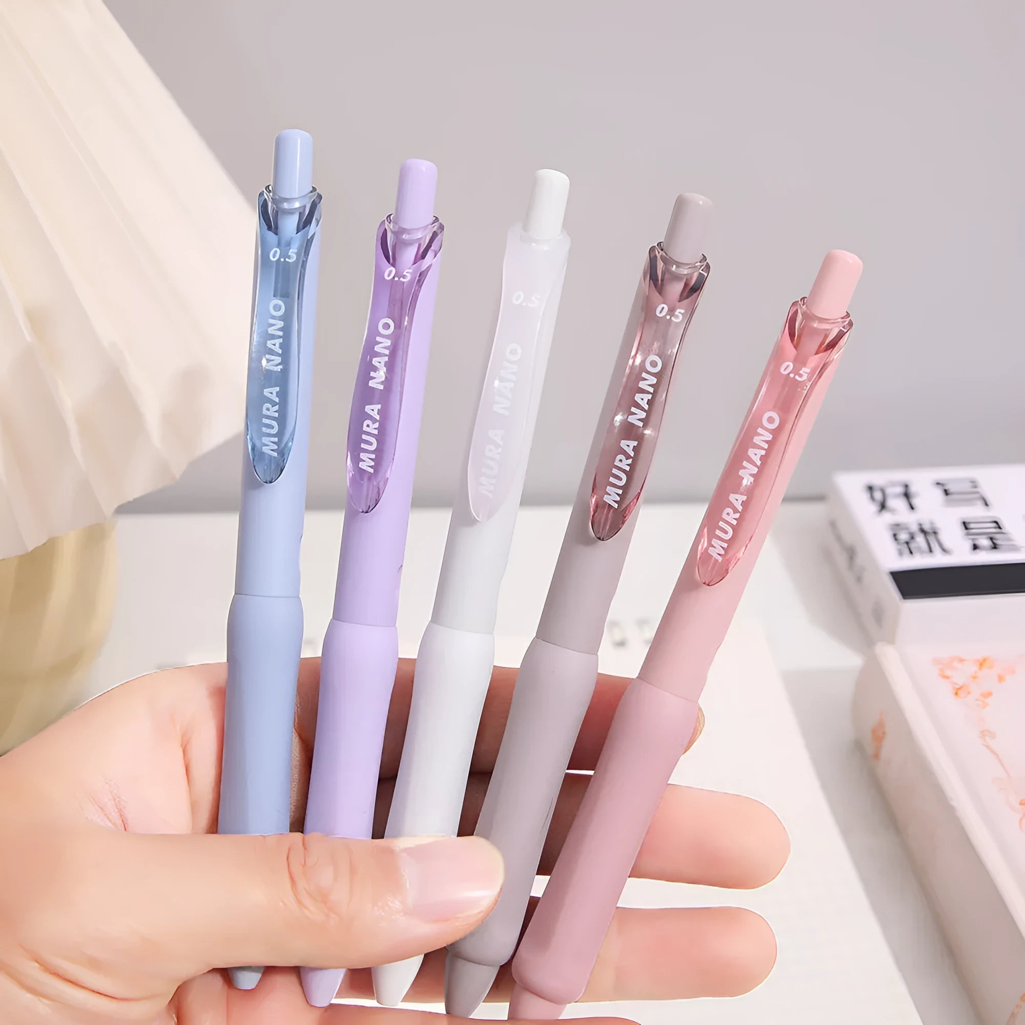 Macaron coloured press gel pen with 0.5mm tip in smoked brown, smoked powder, and smoked white refill options.