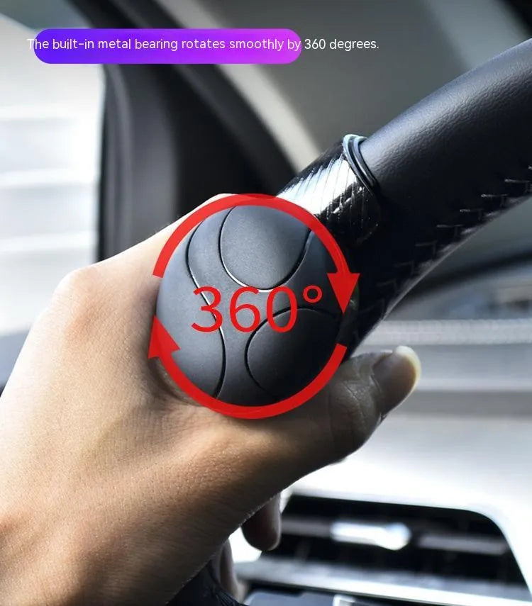 Black and blue silicone steering wheel assist ball with metal bearing for single-hand control