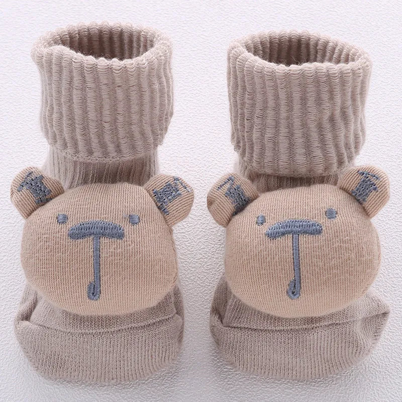 Cotton baby floor socks in various colours and patterns including bows, stars, and animal designs