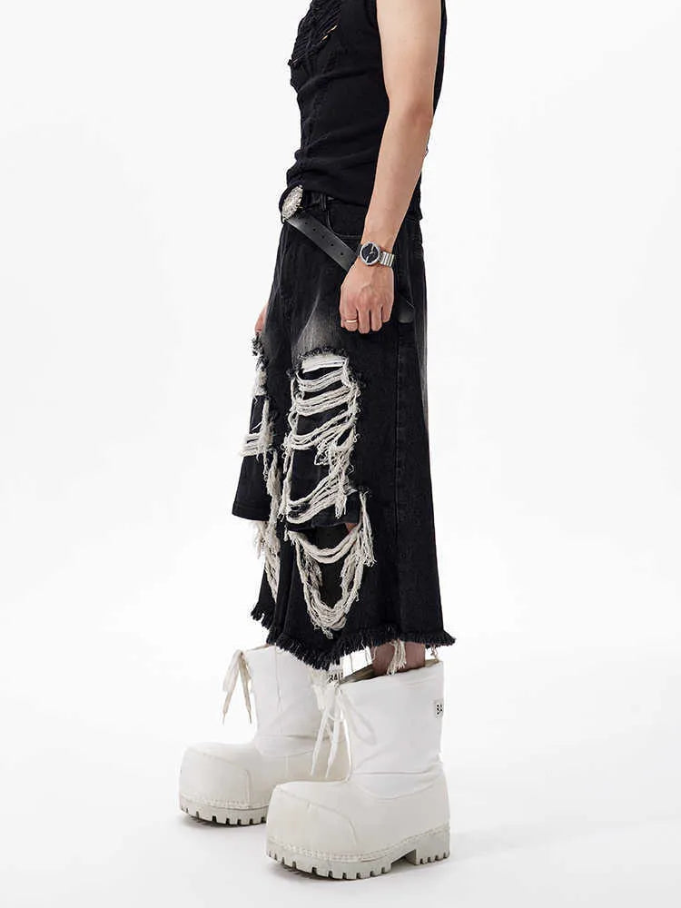 Black cropped wide-leg women's jeans with ripped patches on the knees.