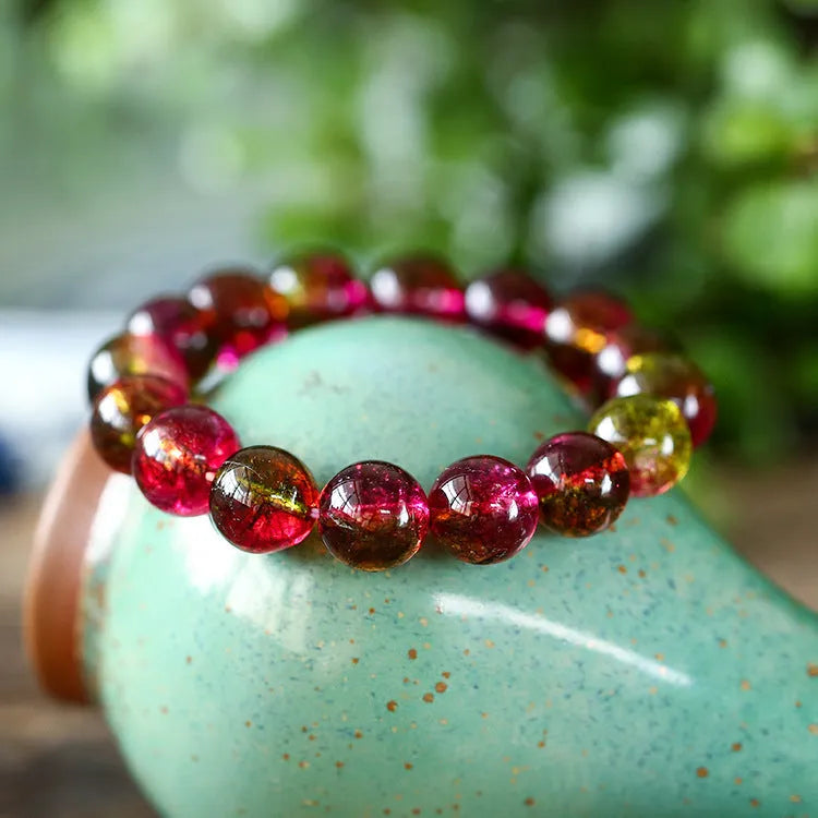 Watermelon crystal bracelet showing crystal beads on wrist, available in 6mm, 8mm, 10mm and 12mm sizes