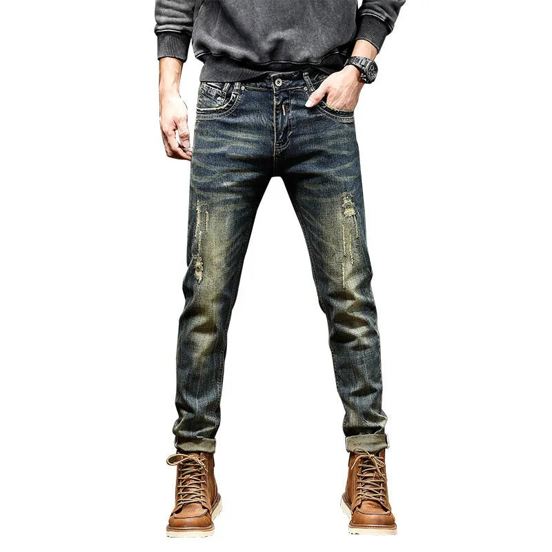 Men's slim-fit jeans in a retro colour with a zip fly, shown laid flat.