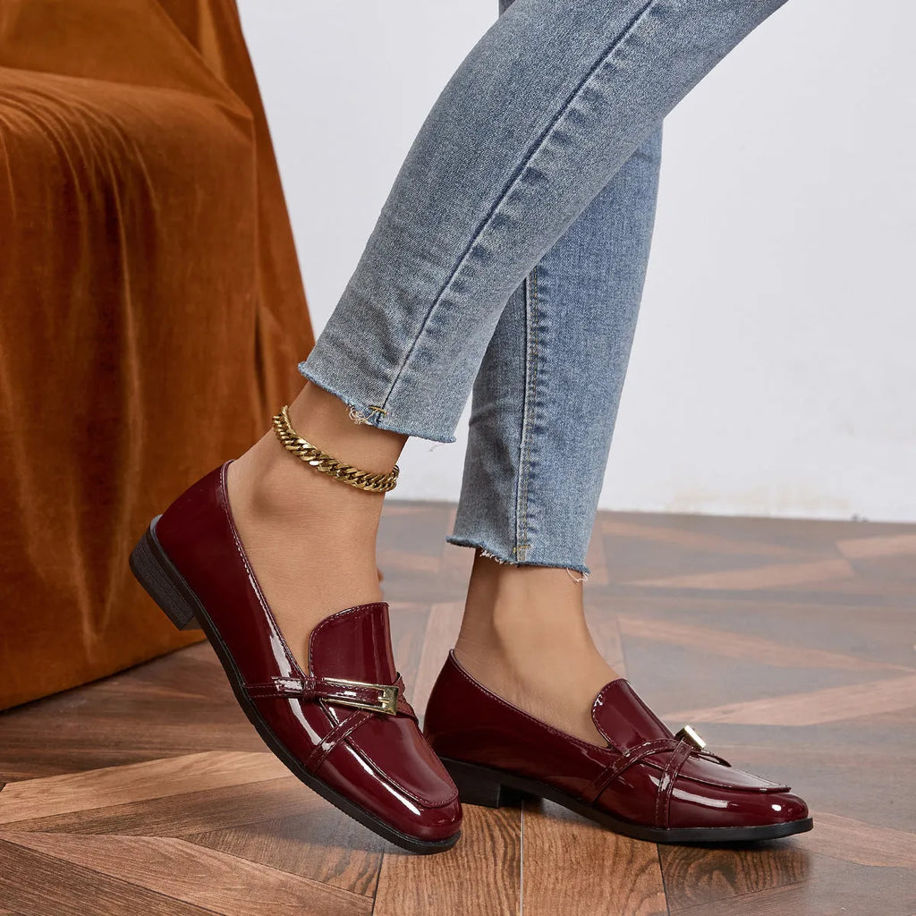 Patent leather square toe loafers in black with low heel and rubber sole