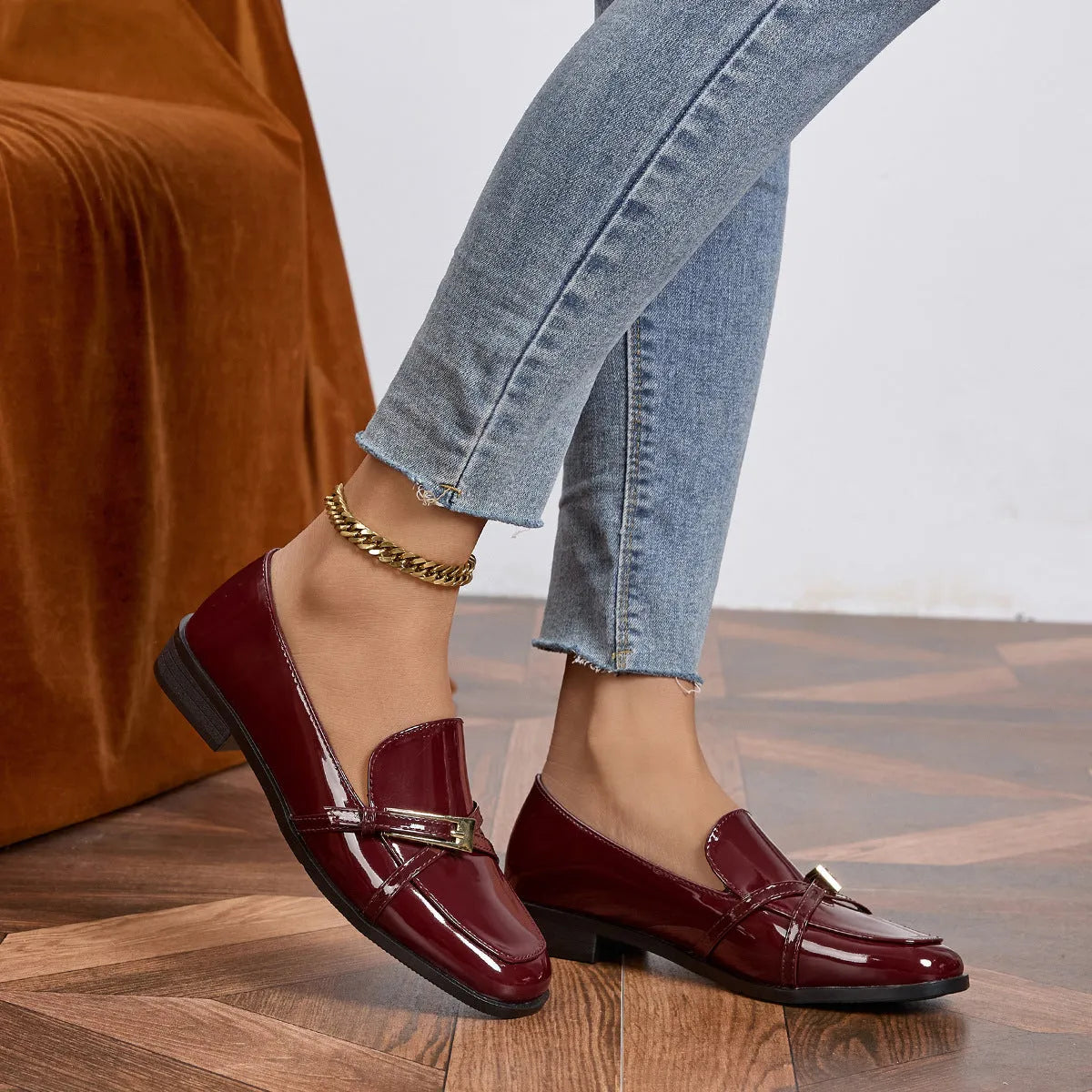 Patent leather square toe loafers in black with low heel and rubber sole