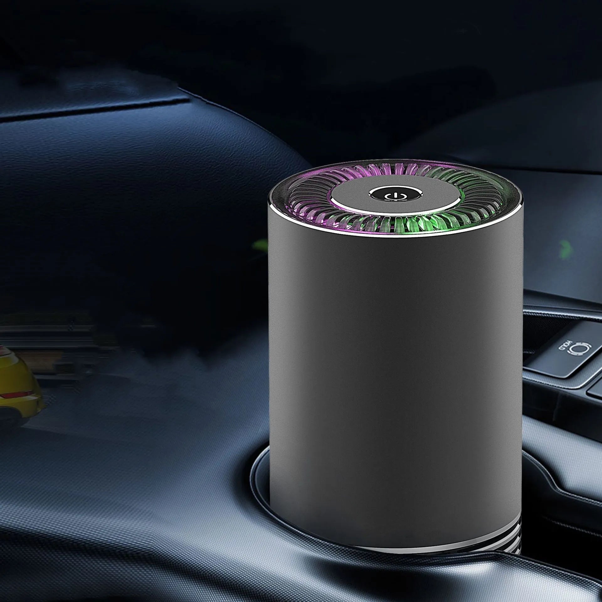 Wireless car air purifier in black, metallic grey, or silver colours, showing compact size for dashboard use.