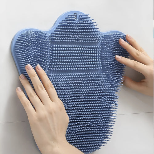 Blue silicone bath scrub mat for back washing, measuring 31cm by 32cm, mounted on a shower wall.