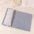 Grey rectangular plush pet cushion for dogs or cats on a wooden floor.