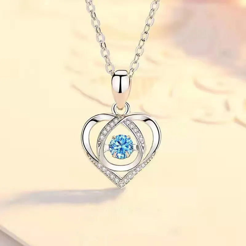 Blue diamond tone heart pendant necklace and matching bracelet set on a copper chain.