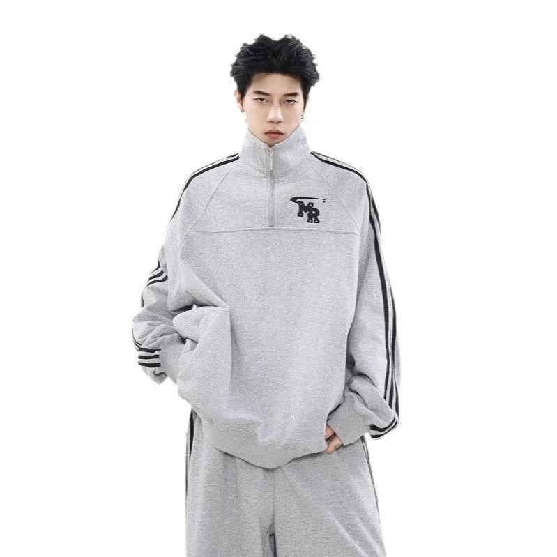 Black retro sports hoodie with a stand collar and long sleeves on a mannequin.