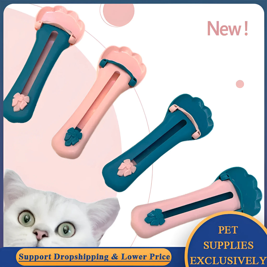 Green and pink pet food squeezer spoon for dispensing treats and liquid food to cats and dogs.