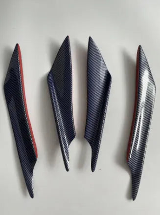 Set of four carbon fibre effect ABS plastic bumper blades for car modification.